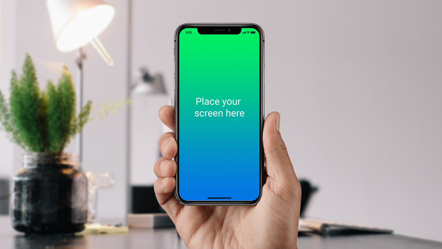 Black iPhone X in Male Hand Mockup