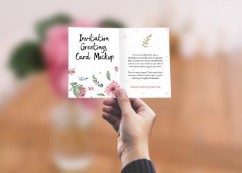 Invitation/Greeting Card in Hand Mockup PSD