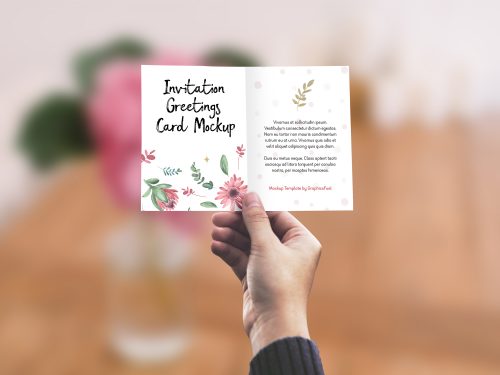 Invitation/Greeting Card in Hand Mockup PSD