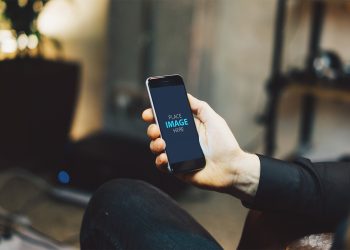 Man Looking At iPhone Mockup