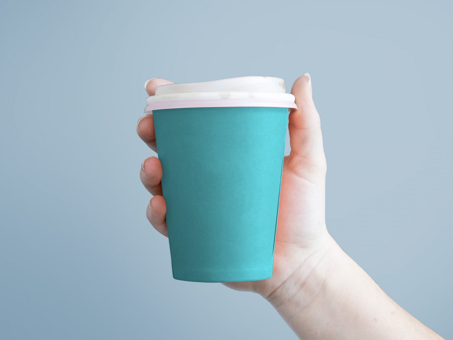 Free Paper Coffee Cup in Hand Mockup PSD