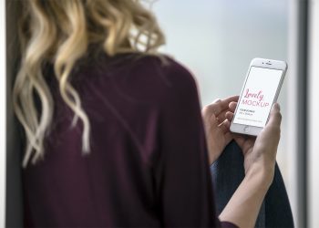 Lady Holding White iPhone Mockup