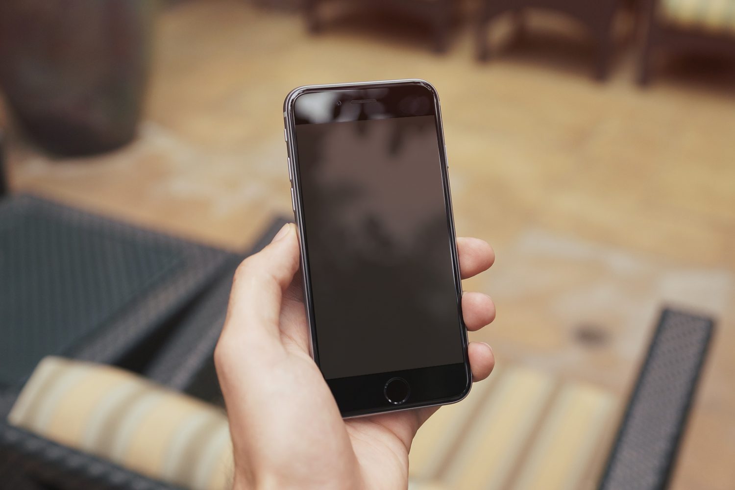iPhone 6 Plus In Woman's Hand Mockup