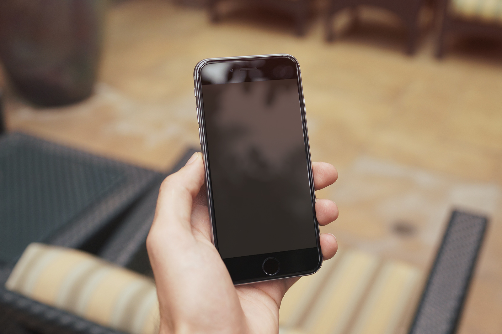 iPhone 6 Plus In Woman's Hand Mockup