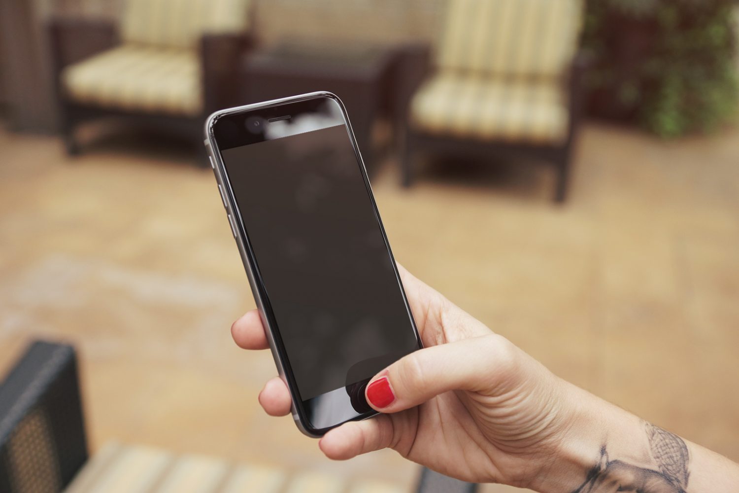 iPhone 6 Plus In Woman's Hand Mockup