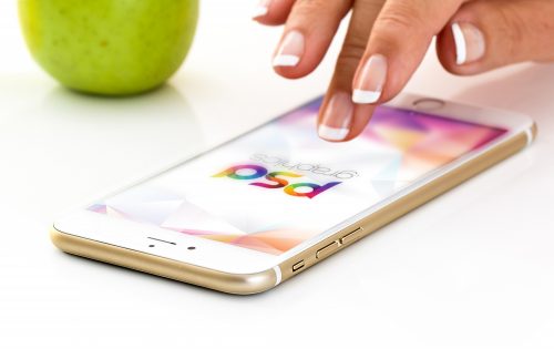 Golden iPhone with Female Hand Mockup