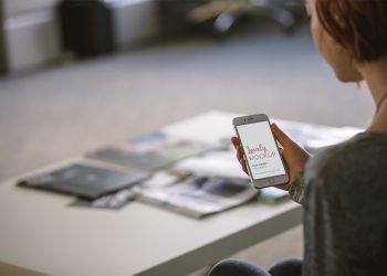 Woman Reading on iPhone Mockup