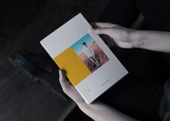 Book in Hand Softcover Free Mockup