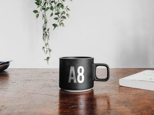 Free Mug on a Table Mockup