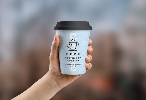 Free Medium and Small Cup in Hand Mockup PSD