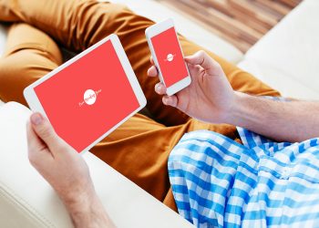 Man Checking His iPad and iPhone Mockup