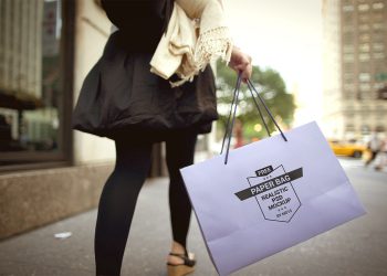 Girl Holding Paper Shopping Bag Mockup