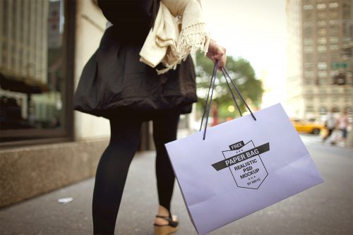 Girl Holding Paper Shopping Bag Mockup