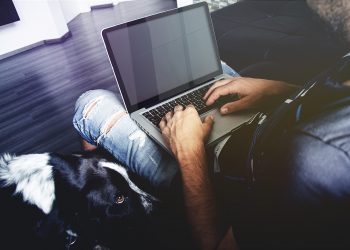 Man Working on a MacBook Pro Mockup