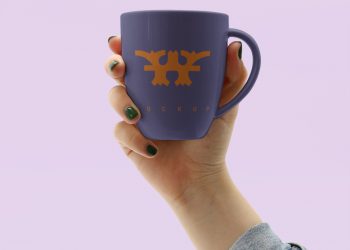 Hand Holding Mug Mockup