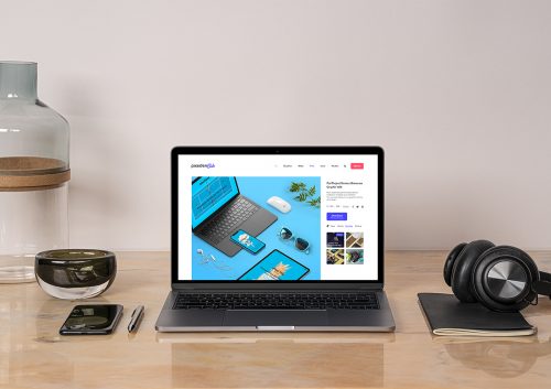 MacBook Pro Mockup on a Desk Workspace Scene