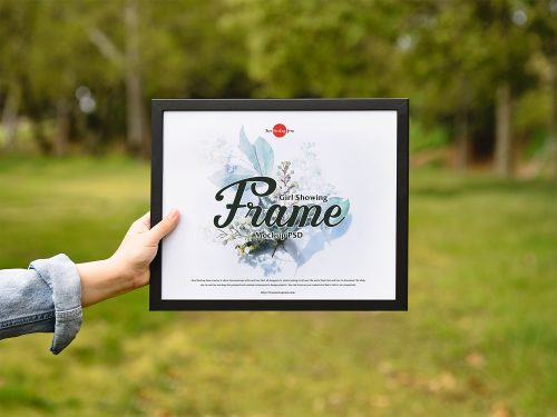 Girl Showing Picture Frame Free PSD Mockup