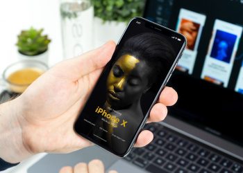 Man Holding iPhone X Mockup PSD