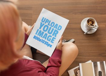 Free Mockup of a Woman Holding a Book