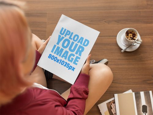 Free Mockup of a Woman Holding a Book