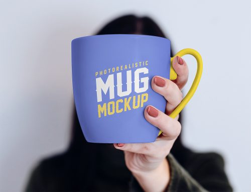 Free Mug in Female Hand Mockup PSD