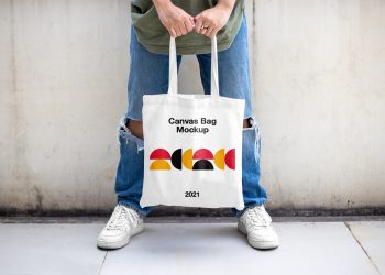 Men Holding Canvas Bag Mockup