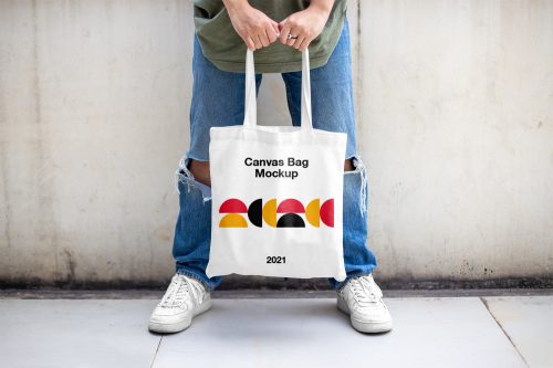 Men Holding Canvas Bag Mockup