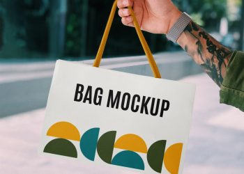 Hand Holding Mini Shopping Bag Mockup