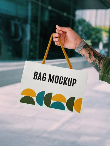 Hand Holding Mini Shopping Bag Mockup