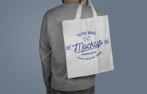 Model Holding a Tote Bag on His Back Free Mockup