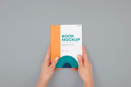 Hand Holding Book Mockup