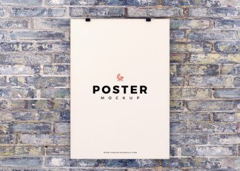 Free Poster Hanging on Brick Wall Mockup