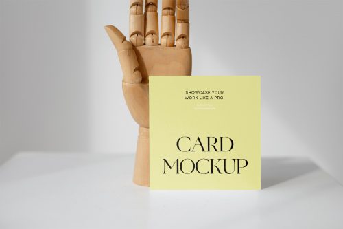 Card with Wood Hand Free Mockup