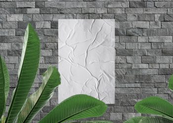 Free Modern Glued Poster on Stone Bricks Wall Mockup