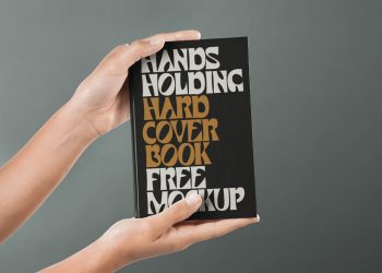 Hand Holding Hardcover Book Mockup