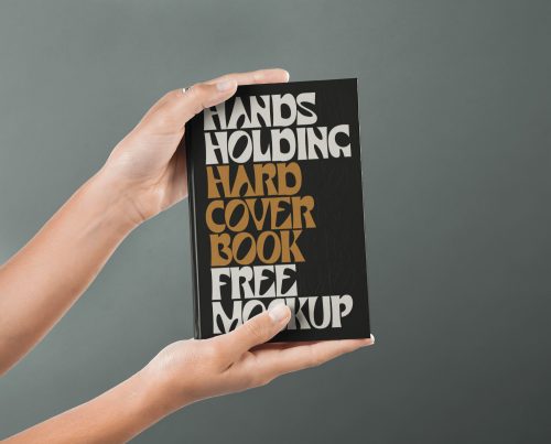 Hand Holding Hardcover Book Mockup