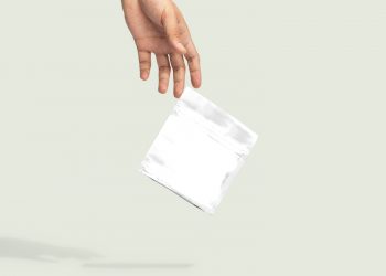 Hand Dropping Paper Bag Free Mockup