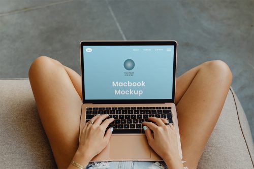 MacBook on Legs Free Mockup