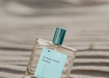 Transparent Bottle on Sunny Beach Free Mockup