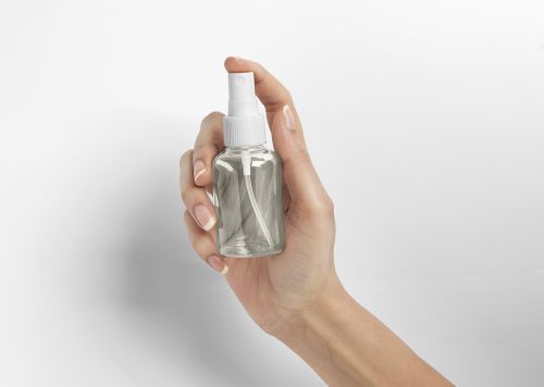 Spray Bottle with Woman Hand Free Mockup