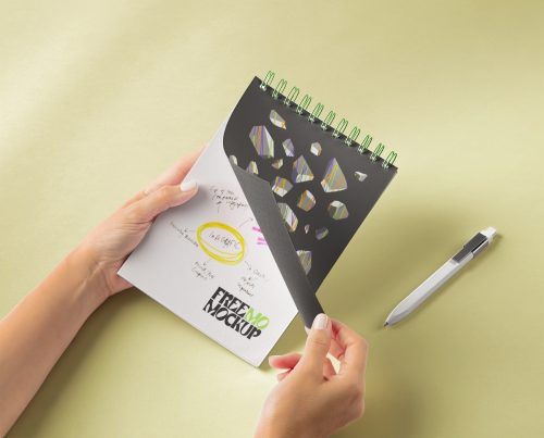 Hands Holding Spiral Notebook Free Mockup