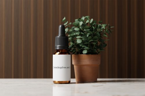 Amber Glass Dropper Bottle with Eucalyptus Plant Free Mockup