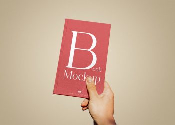 Book Cover in Hand Free Mockup