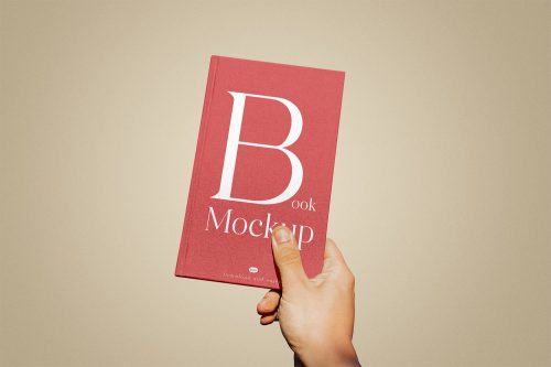 Book Cover in Hand Free Mockup