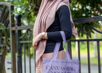 Woman in Park Holding Canvas Bag Free Mockup