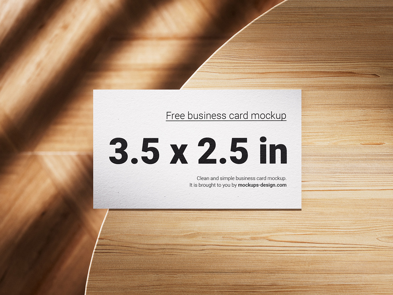 Business Cards Lying on a Wooden Table Free Mockups