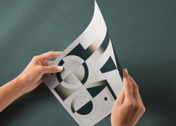 Hand Holding Glossy Paper Free Mockup