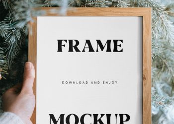 Wooden Frame in Hand Mockup