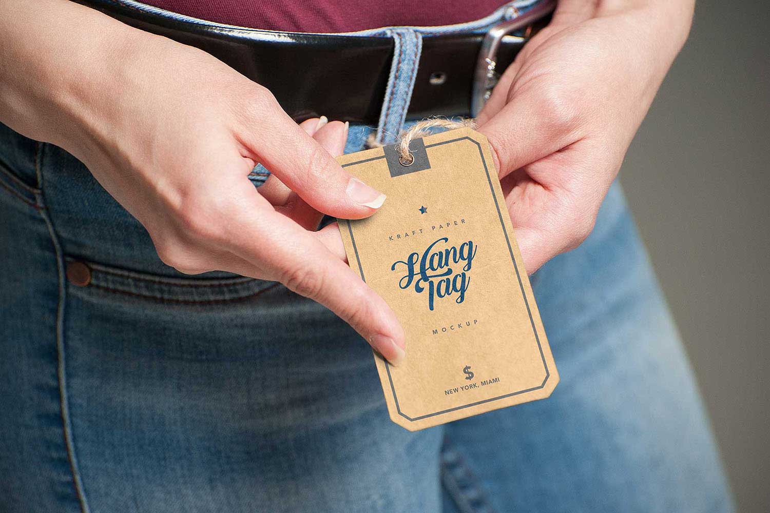 Hand Holding Kraft Paper Label Tag Mockup