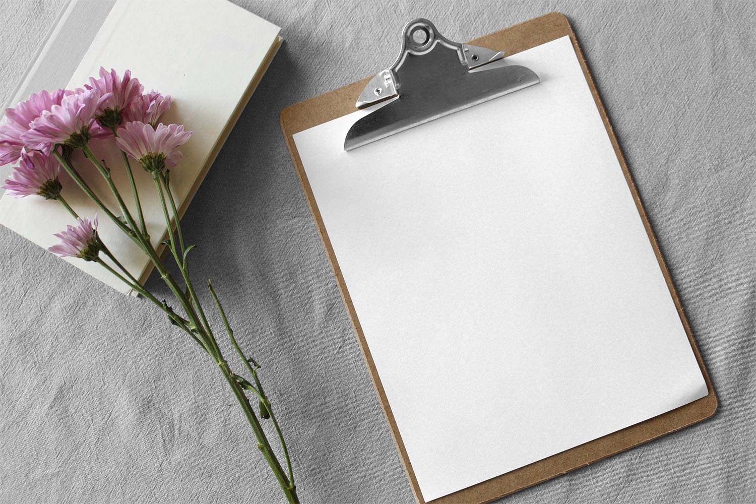 Free Paper Clipboard Mockup Scene with Flowers